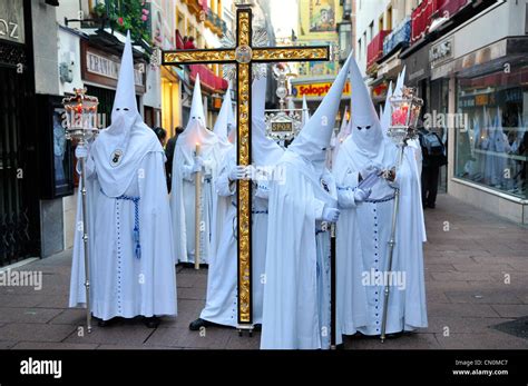 Spain Seville Semana Santa Holy Week Easter Nazarenos or members of the Resurreccion Brotherhood ...