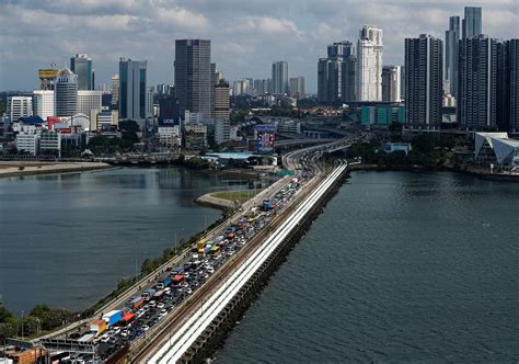 Singapore faces bigger contraction as Malaysia shuts borders