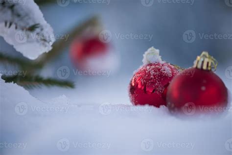 red christmas balls in fresh snow 11293411 Stock Photo at Vecteezy