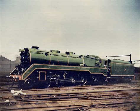 [Newly painted C38 locomotive outside carriage works at the Eveleigh workshops] | NSW State Archives