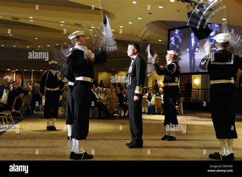 A ceremonial rifle drill team performs at the Navy-Marine Corps Relief ...