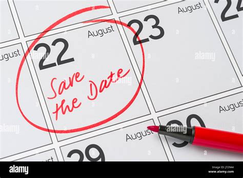 Save the Date written on a calendar - August 22 Stock Photo - Alamy