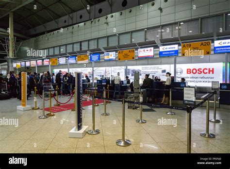 Almaty, Kazakhstan - September, 2018: Almaty airport departure terminal check-in counter area ...