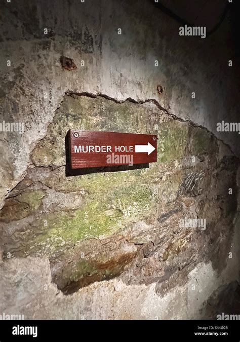 A sign pointing to the murder hole at Blarney Castle in Blarney, Ireland Stock Photo - Alamy