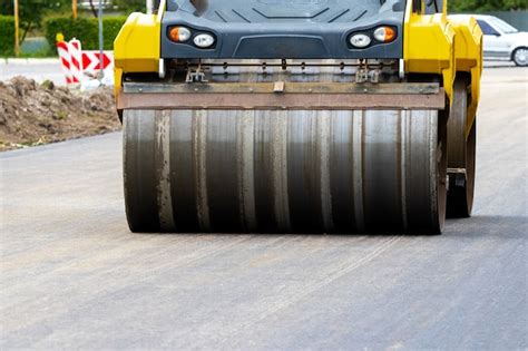 Premium Photo | Asphalt paver on the road during asphalt laying in defocus. road repair. laying ...