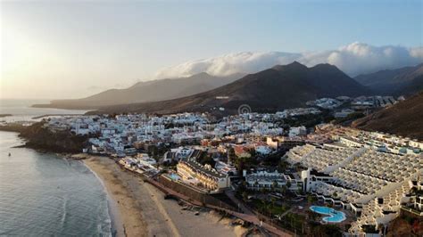 Aerial of a Coastal City on Canarian Islands with a Beautiful Landscape during the Sunset ...