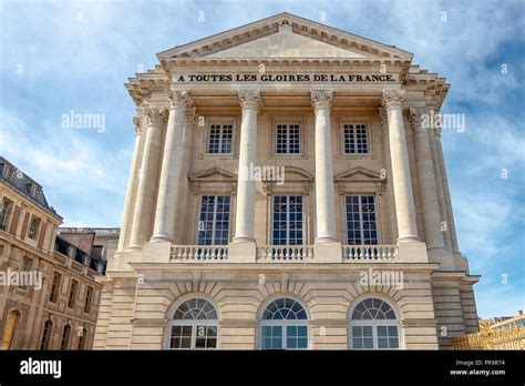 Exterior facade of Versailles Palace. Detail of visitors main entrance ...