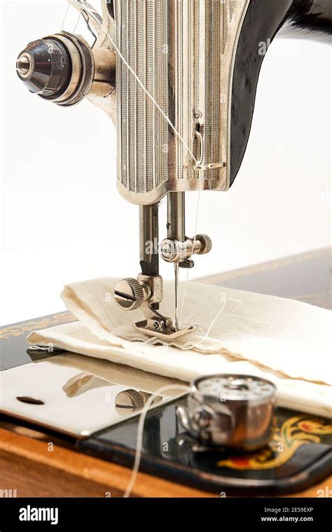 Sewing machine and parts on a white background Stock Photo - Alamy