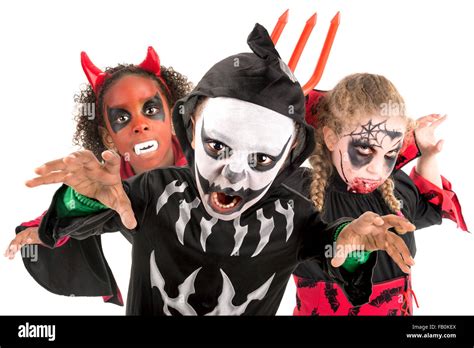 Group of kids with face-paint and Halloween costumes Stock Photo - Alamy