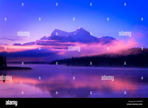 Foggy mountain sunrise Stock Photo - Alamy