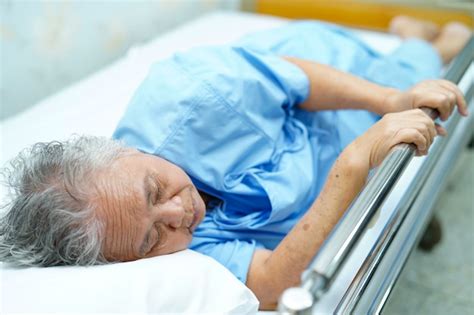 Premium Photo | Asian senior or elderly old lady woman patient lying on bed in nursing hospital.