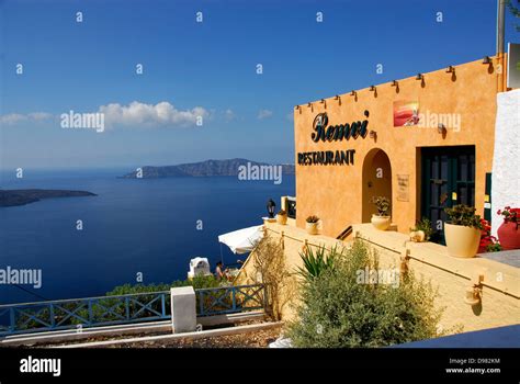 Restaurant on the cliff-top town of Fira on the Island of Santorini Stock Photo, Royalty Free ...