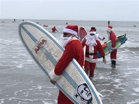 Surfing Santas Hit The Waves in Cocoa Beach, Florida – Travel. Sip. Repeat.