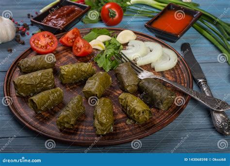 Dolma in grape leaves stock photo. Image of cutlery - 143068598