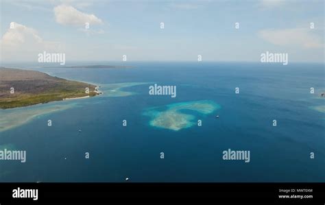 Aerial view coral reef, atoll with turquoise water in the sea.Tropical atoll, coral reef in ...