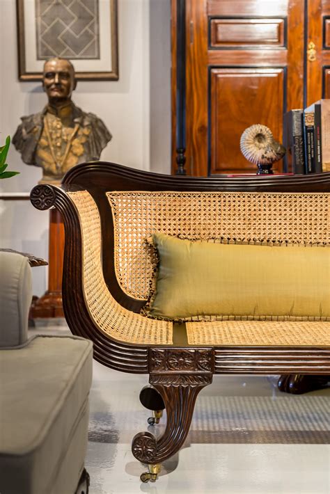 Detail of a British Colonial sofa made from rosewood with a hand woven cane seat. Dating from ...