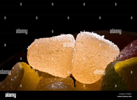 +yellow fruit candies in the ray of light Stock Photo - Alamy