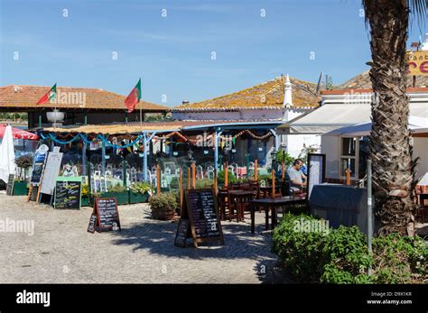 Traditional fish restaurants in the fishing town of Alvor, Portugal ...