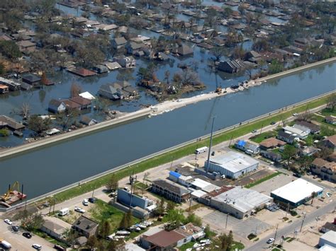 New Orleans After Hurricane Katrina Showing A Levee Break Under Repair And Flooding On One Side ...