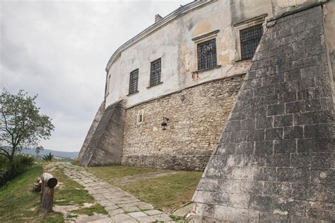 Premium Photo | Stone wall of a medieval castle on a hill