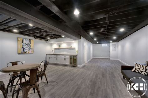 Finished basement with wet bar, babylon gray quartz, subway tile, black ...