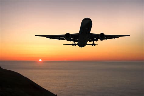 Jet plane in a sky at sunset - Khoirulpage