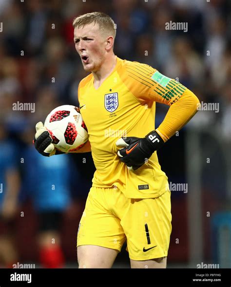 England goalkeeper Jordan Pickford reacts after his side concede during ...