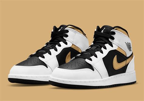 Air Jordan 1 Mid Kids White Black Gold 554725-190 | SneakerNews.com