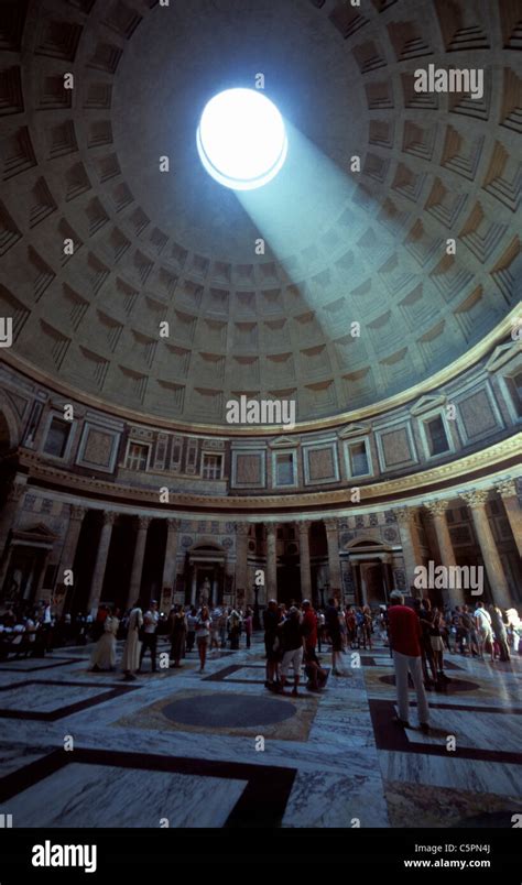 Interior view of the Pantheon receiving light from the oculus in the dome's apex, Rome, Latium ...