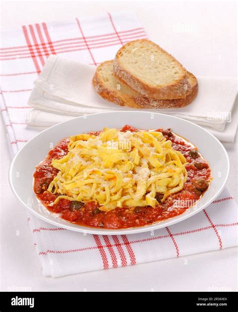 Uova in Trippa (Italian omelette strips in tomato sauce Stock Photo - Alamy