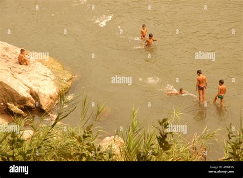 Children playing in the mekong river in laos Stock Photo - Alamy