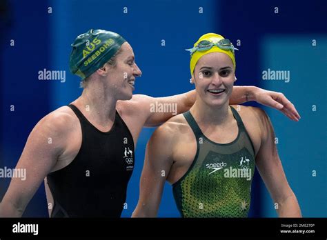 Kaylee Mckeown, of Australia, is embraced by teammate Kaylee Mckeown after winning the gold ...