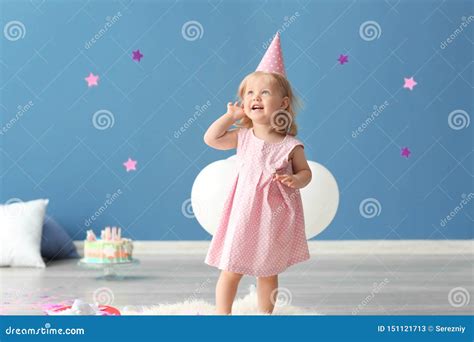 Cute Little Girl in Birthday Party Cap Playing with Paper Confetti ...