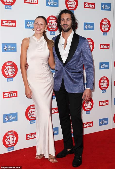 Strictly's Zara McDermott looks elegant in a cream satin dress as she ...