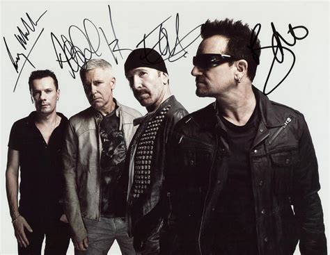 Lot Detail - U2 Group Signed 11" x 14" Color Photograph w/ All Four Members (JSA)