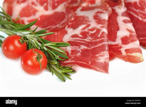 Italian lonza on white background Stock Photo - Alamy