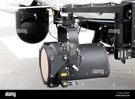 Police helicopter search light and camera pod Stock Photo - Alamy