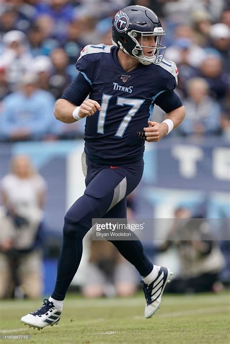 Ryan Tannehill of the Tennessee Titans runs on the field during the... | Tennessee titans ...