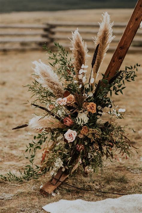 Boho Western Inspired Wedding | Boho wedding flowers, Wedding flower arrangements, Wedding arch ...