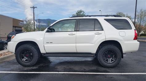 a white suv parked in a parking lot