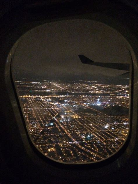 City Lights from an Airplane Window at Night