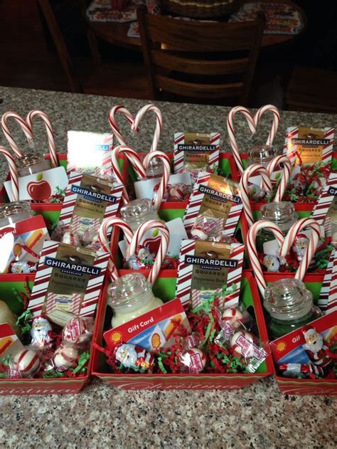 Christmas baskets for staff. Small Yankee candles with a gift card hot glued on candy canes ...