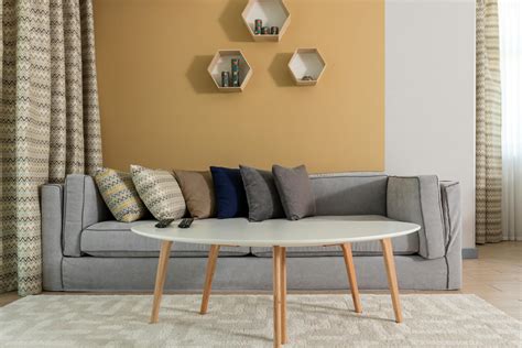 Stylish interior of modern living room with comfortable sofa · Free Stock Photo