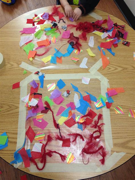 Art activity for toddlers: contact paper and scraps of different materials (yarn, tissue pap ...