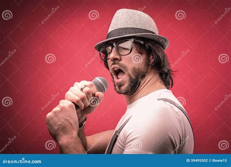 Man Singing With A Microphone Stock Photo - Image: 39495502