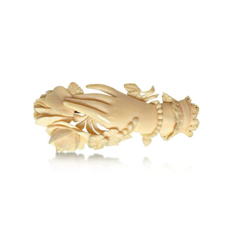 A VICTORIAN HAND-CARVED IVORY BROOCH, CIRCA 1860S — Revival Jewels