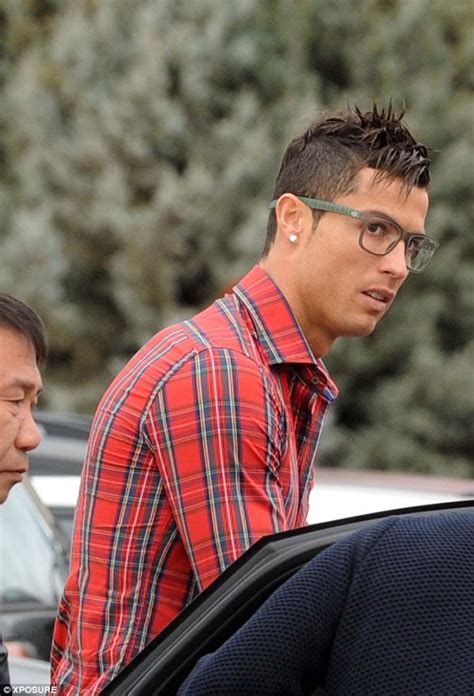 Cristiano Ronaldo dons geeky glasses to pick up his son from school after landing a two-match ...