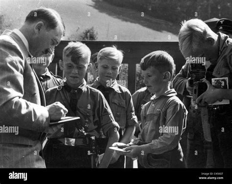 Adolf Hitler gives autographs to Hitler Youth, 1935 Stock Photo - Alamy