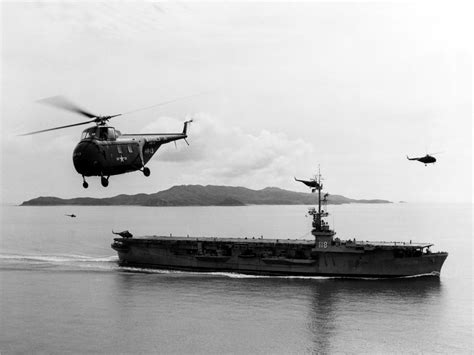 US Navy Sikorsky HO4S flying near USS Sicily during Korean War image ...