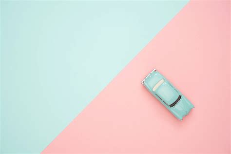 Download A Mini Toy Car in Pastel Green Wallpaper | Wallpapers.com